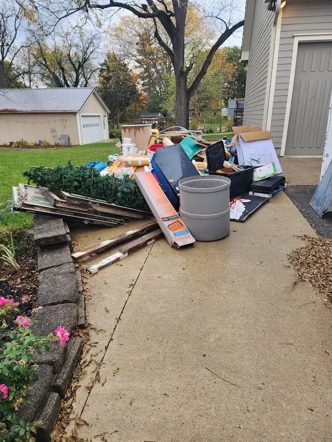 Dumpster being loaded with debris for Residential Dumpster Rental in Bloomingdale